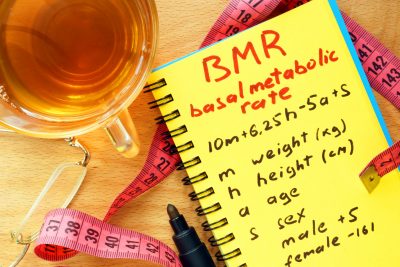 BMR basal metabolic rate formula in a notepad.